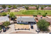 Charming single-story home with a carport, situated near a park with green fields and playground in a Gathering-friendly neighborhood at 6501 W Columbus Ave, Phoenix, AZ 85033