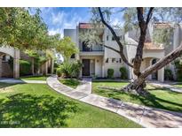 Charming home with a red tile roof, balcony and large shade tree in the front yard at 8225 N Central Ave # 44, Phoenix, AZ 85020