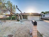 Charming single-story home features a low maintenance yard and a two-car garage at 19604 N 13Th Ave, Phoenix, AZ 85027