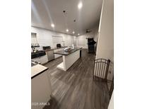 Spacious kitchen featuring an island, modern appliances, and lots of natural light from the windows at 2249 E Pinto Dr, Gilbert, AZ 85296