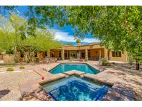 Private pool with jacuzzi and desert landscaping, designed for relaxation and entertainment in the backyard at 26156 N 88Th Way, Scottsdale, AZ 85255