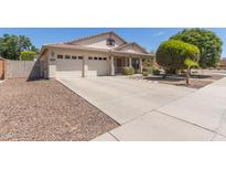 Charming single-Gathering home featuring a three-car garage and a well-manicured front yard at 3580 E Kesler Ln, Gilbert, AZ 85295