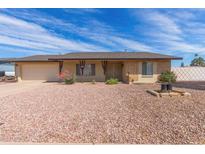 Charming single-story home with a brick and beige facade, complemented by a well-maintained, desert-landscaped front yard at 4106 W Mission Ln, Phoenix, AZ 85051