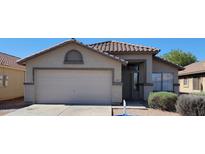 Charming single-story home with a two-car garage and well-maintained desert landscaping at 419 W Harwell Rd, Phoenix, AZ 85041