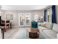 Cozy living room featuring modern decor and a view of the dining area at 7915 E Keim Dr, Scottsdale, AZ 85250