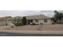 Charming single-story home featuring desert landscaping and a well-maintained lawn at 2022 Leisure World --, Mesa, AZ 85206