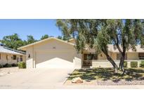 Charming single-story home with a well-maintained lawn and a two-car garage, offering comfort and convenience at 21218 N Aurora Dr, Sun City West, AZ 85375