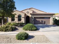 Charming single-story home featuring a two-car garage and well-maintained desert landscaping at 2611 E San Paulo Dr, Casa Grande, AZ 85194