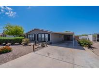 Charming single-story home with covered parking and well-maintained desert landscaping at 2807 W Gregory St, Apache Junction, AZ 85120