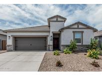 Charming single-Gathering home showcasing a well-manicured lawn and neutral color palette at 2923 W Shanley Ave, Apache Junction, AZ 85120