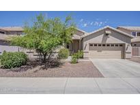 Charming single-story home with a well-manicured front yard and two-car garage at 5926 W Questa Dr, Glendale, AZ 85310