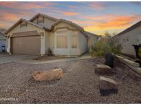 Charming single-story home with desert landscaping and a two-car garage at 8339 W Bluefield Ave, Peoria, AZ 85382