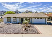 Charming single-story home with desert landscaping and mountain views in a sunny locale at 11210 S Bannock St, Phoenix, AZ 85044