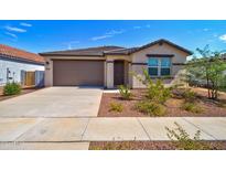 Charming single-story home with a well-manicured front yard and a two-car garage at 1130 E Meadowbrook Dr, Casa Grande, AZ 85122