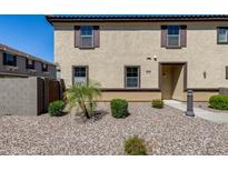 Two-story stucco home with brown trim, shutters and desert landscaping at 1265 S Aaron -- # 277, Mesa, AZ 85209