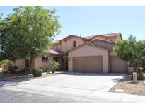 Charming two-story home with a three car garage and well-manicured landscaping at 1360 S Camellia Ct, Chandler, AZ 85286
