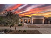 Beautiful single-Gathering home with desert landscaping and a stunning sunset sky at 22991 E Via De Olivos --, Queen Creek, AZ 85142