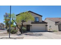Charming two-story home with a well-manicured front yard and attached two-car garage at 3405 W La Salle St, Phoenix, AZ 85041