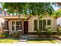 Charming single-story home featuring a well-manicured lawn and inviting front entrance in a desirable neighborhood at 3477 E Sheffield Rd, Gilbert, AZ 85296