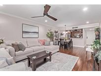 Inviting living room with a plush sectional sofa and stylish decor, perfect for relaxation and entertaining at 4120 N 78Th St # 216, Scottsdale, AZ 85251