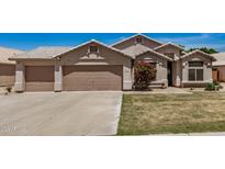 Charming single-story home featuring a low-maintenance front yard and a spacious three-car garage at 654 W Fremont Dr, Tempe, AZ 85282