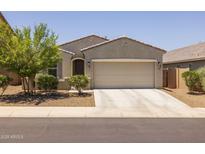 Charming single-story home with a two-car garage and a well-maintained, low maintenance landscaped front yard at 7732 S 23Rd St, Phoenix, AZ 85042
