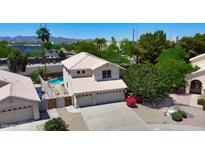Charming two-story home with a three car garage, mature landscaping, and private pool at 8228 S Stephanie Ln, Tempe, AZ 85284