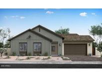 Charming single story home with a two car garage, low maintenance front yard and neutral colored exterior at 852 W Golden Ore Pass, Apache Junction, AZ 85120