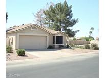 Charming single-story home featuring a two-car garage, bay window, and well-maintained landscaping at , Mesa, AZ 85205