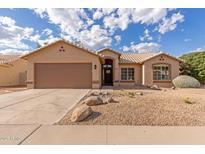 Charming single-story home with a two-car garage, desert landscaping, and neutral exterior paint at 13414 E Cindy St, Chandler, AZ 85225