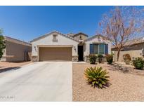 Charming single-story home with a two-car garage and low-maintenance desert landscaping at 19834 N Tammy St, Maricopa, AZ 85138
