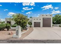 Charming home with a two-car garage, inviting curb appeal, and a well-maintained front yard at 9035 W Villa Chula --, Peoria, AZ 85383