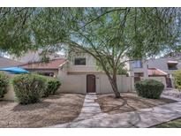 Charming two-story home with a private courtyard and lush desert landscaping at 9807 N 5Th St, Phoenix, AZ 85020
