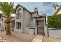 Charming two-story home featuring unique architectural details and a well-maintained front yard with desert landscaping at 1535 N Horne -- # 67, Mesa, AZ 85203