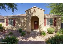 Charming single-story home featuring a welcoming arched entryway and low-maintenance desert landscaping at 3450 E Milky Way, Gilbert, AZ 85295