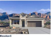 Charming single-story home with desert landscaping and a two-car garage at 4936 S 106Th Ln, Tolleson, AZ 85353