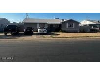 Charming single-story home with a well-maintained front yard and ample parking space at 7808 W Clarendon Ave, Phoenix, AZ 85033