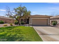 Charming single-Gathering home featuring a well-manicured lawn and a two-car garage in a desirable neighborhood at 8237 W Alex Ave, Peoria, AZ 85382