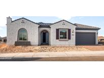 Charming single-story home with a well-manicured front yard and stucco finish at 26914 W Renee Dr, Buckeye, AZ 85396