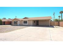 Charming single-story home with a spacious driveway and desert landscaping at 3513 W Maryland Ave, Phoenix, AZ 85019