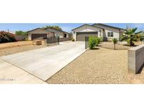 This is a charming single-Gathering home with a well-maintained exterior, a long driveway, and a two-car garage at 3806 N 23Rd Ave, Phoenix, AZ 85015