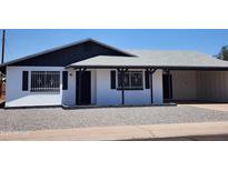 Charming single-story home featuring a new roof and fresh white paint at 5336 W Lewis Ave, Phoenix, AZ 85035