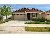 Charming single-story home with a well-maintained front yard and a two-car garage at 9829 E Talon Ave, Mesa, AZ 85212