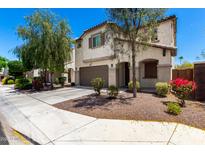 Inviting two-story home boasts stucco siding, a two-car garage, and lovely curb appeal with desert landscaping at 15423 N 22Nd Dr, Phoenix, AZ 85023