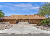 Charming townhouse with desert landscaping, a private two-car garage, and concrete driveway at 15834 E Sunflower Dr # 2, Fountain Hills, AZ 85268