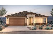 Charming single-story home with a tile roof, desert landscaping, and a spacious two-car garage at 18702 N 267Th Dr, Buckeye, AZ 85396