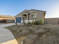 Beautiful single-story home with desert landscaping and a two-car garage at 20279 N 224Th Dr, Surprise, AZ 85387