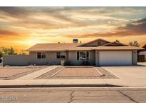 Charming single-story home featuring a two-car garage and low-maintenance landscaping in a desirable neighborhood at 2327 E Pebble Beach Dr, Tempe, AZ 85282