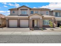 Charming two-story home featuring a three-car garage and a well-maintained, xeriscaped front yard for low maintenance at 2831 W Margy Ct, Phoenix, AZ 85017
