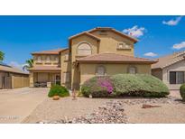 Charming two-story home featuring a well-maintained yard and desert landscaping at 30013 N Candlewood Dr, San Tan Valley, AZ 85143